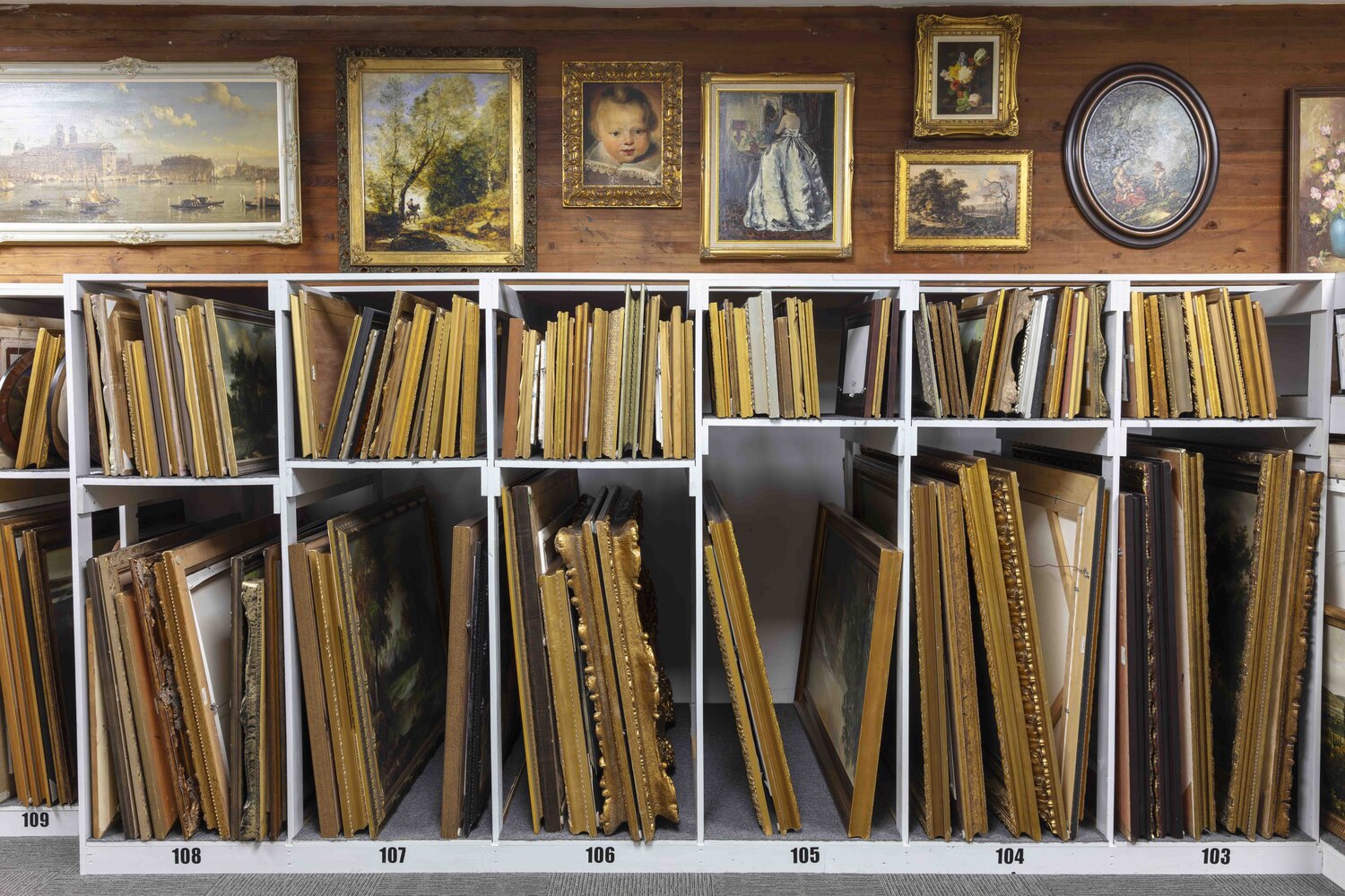 The AION art catalogue, shelves of framed paintings
